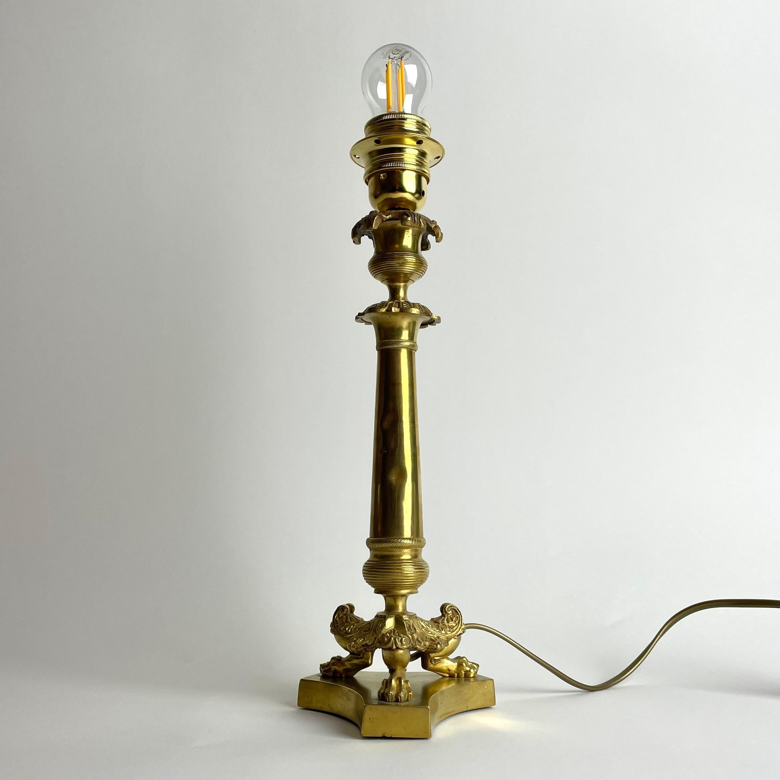 Elegant Table Lamp in bronze. Originally an Empire candlestick from the 1820s In Good Condition For Sale In Knivsta, SE