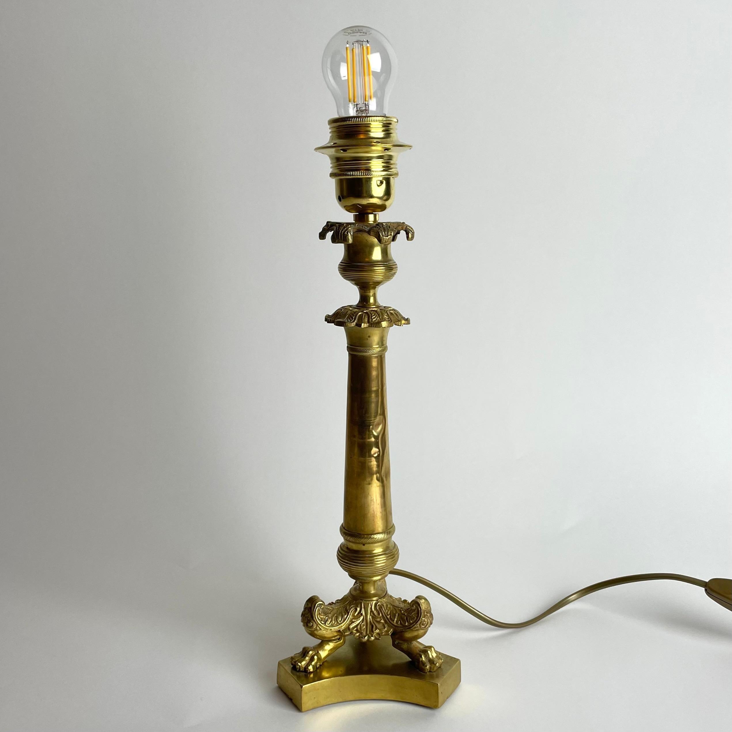 Early 19th Century Elegant Table Lamp in bronze. Originally an Empire candlestick from the 1820s For Sale