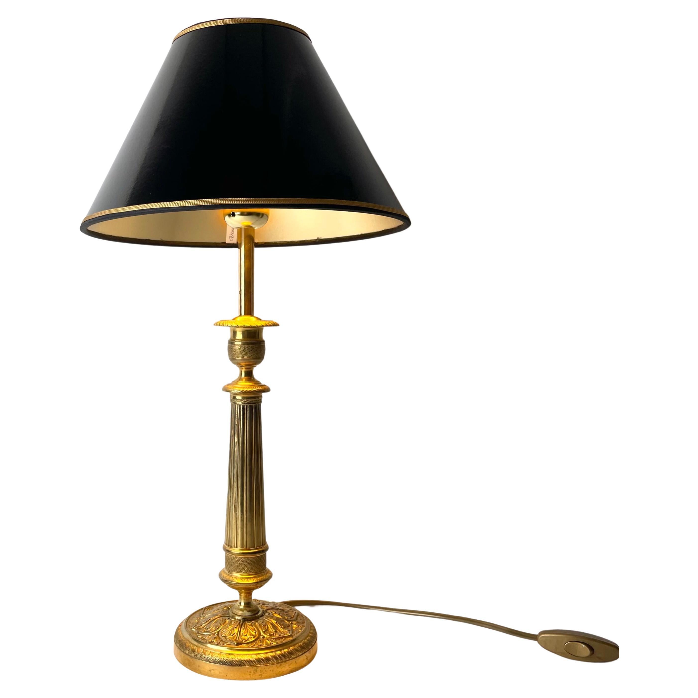 Elegant Table Lamp in bronze. Originally an Empire candlestick from the 1820s