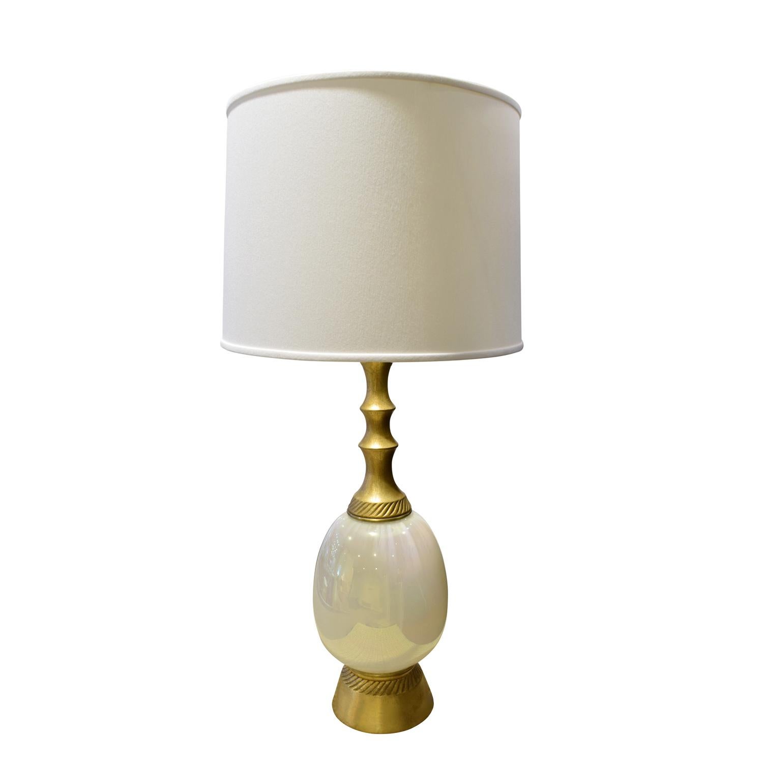 Elegant table lamp, gilded with opaline glass, by F.A.I.P., American, 1950s (signed on base).

Measures:
Shade diameter 18 inches
Shade height 12 inches.