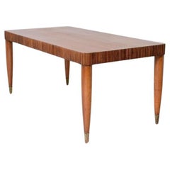 Elegant table with band motif in grissinato wood