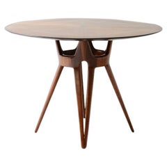 Elegant table with carved wooden base