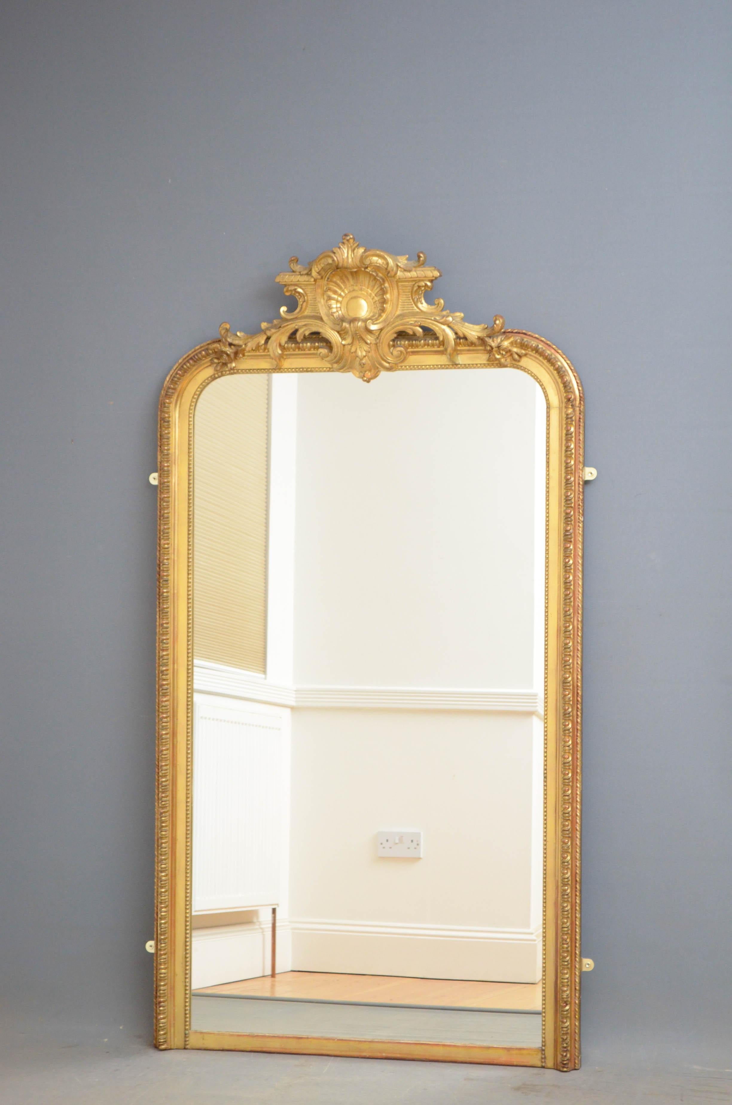 Sn4772 slim and tall 19th century gilt mirror with a replacement glass in beautifully decorated frame with centre crest to the top, all in fantastic home ready condition, circa 1870
Measures: H69