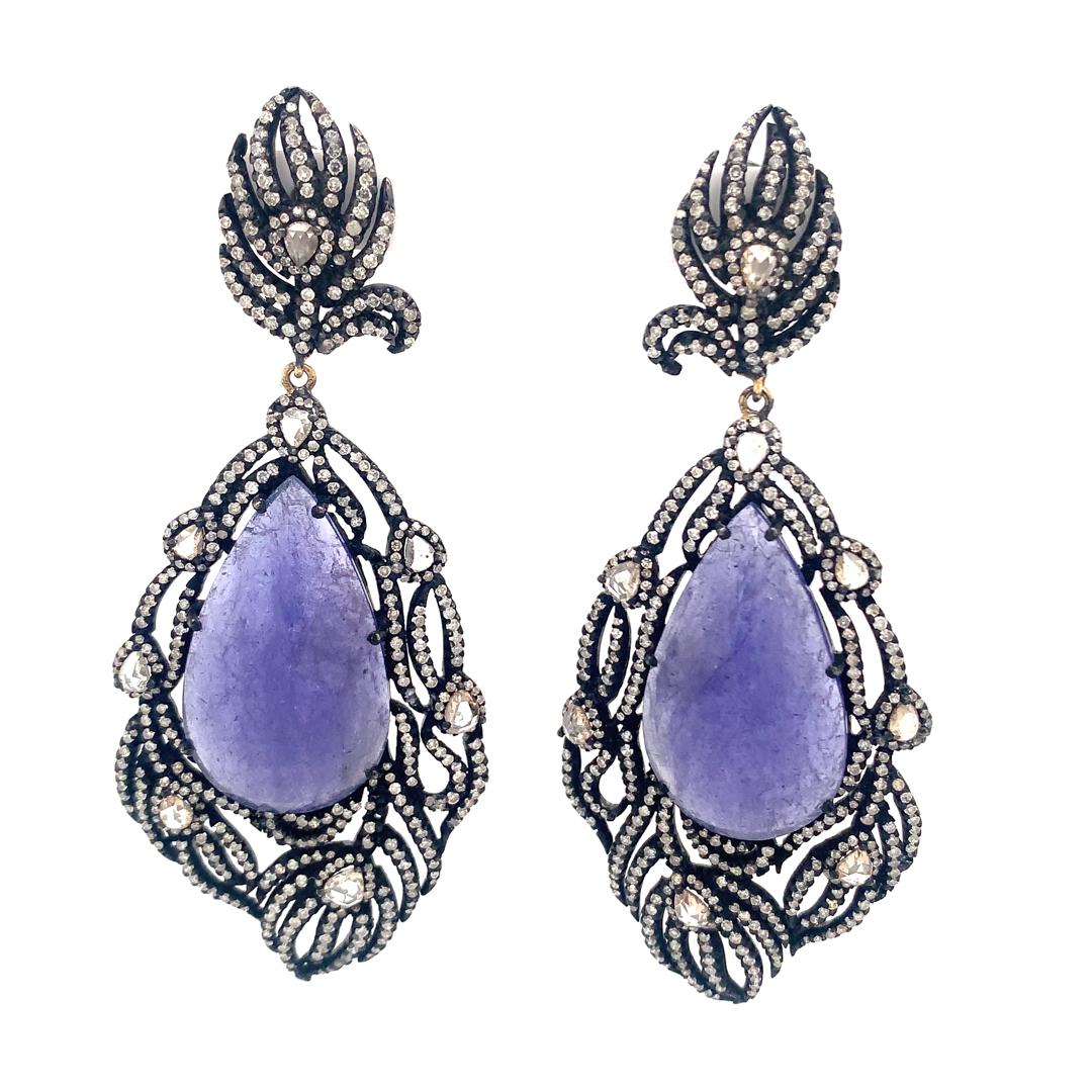 Beautiful pair of natural 47.14-Carat Tanzanite and 6.35-Carat Diamond Earrings set in Sterling Silver. 