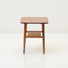 Elegant Teak Wood Side Table with 2 Wheels and Cane Wicker Shelf, 1960s Sweden