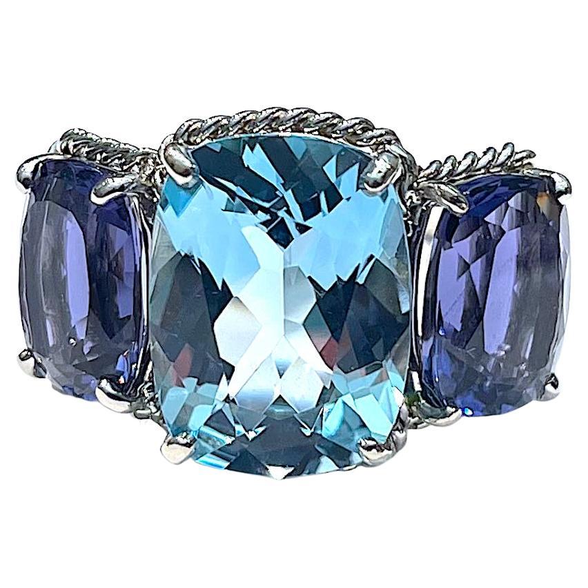 Elegant Three-Stone Blue Topaz and Iolite Ring with Gold Rope Twist Border For Sale