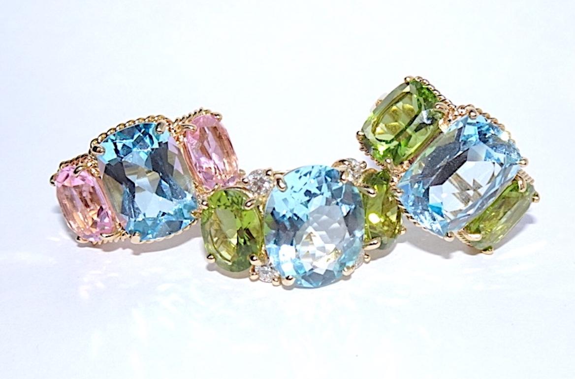 Contemporary Elegant Three-Stone Blue Topaz and Pink Topaz Ring with Gold Rope Twist Border For Sale