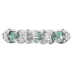 Elegant Three-Stone Ring Natural Green and White Diamonds in Timeless Design