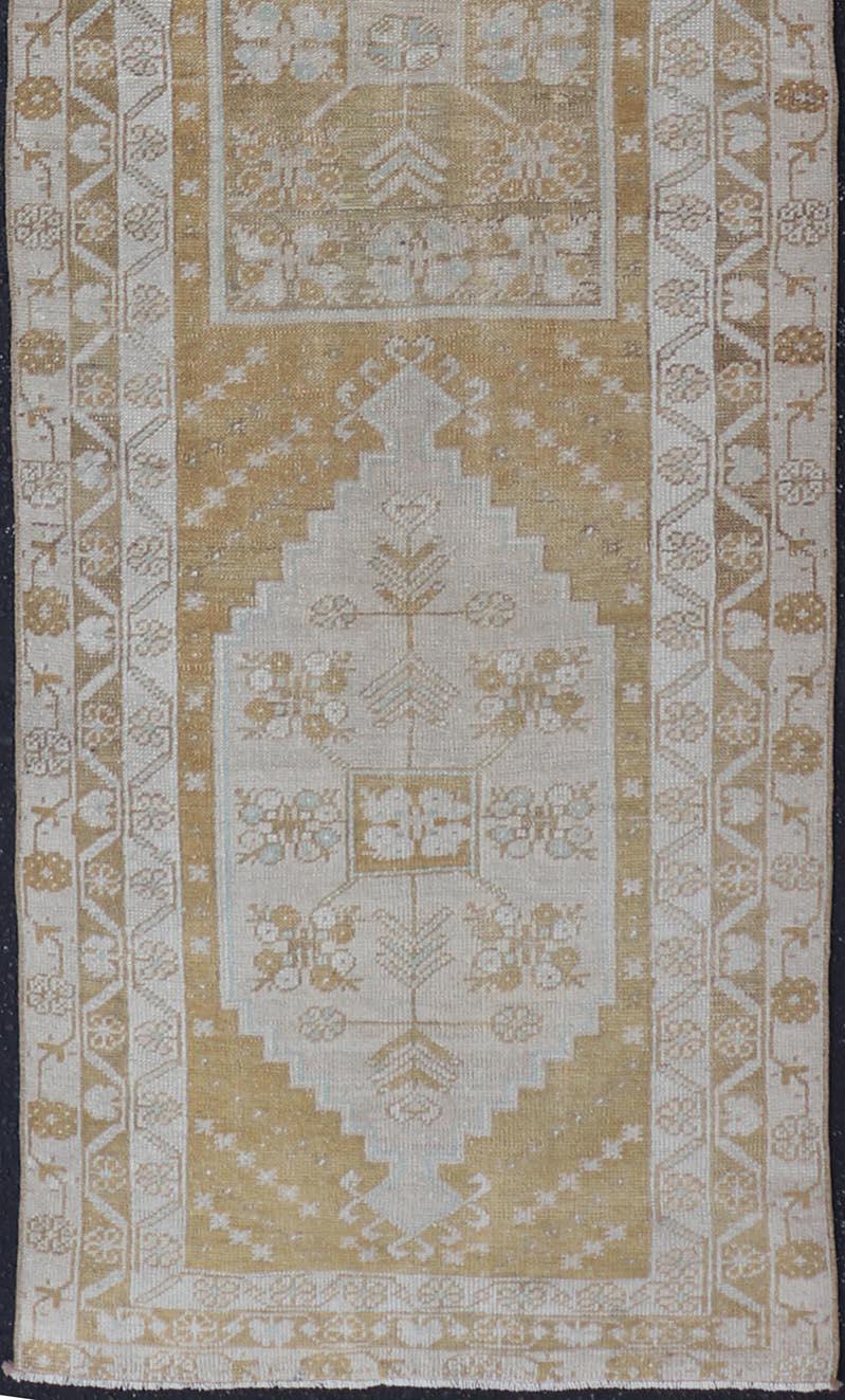 20th Century Elegant Turkish Oushak Runner with Geometric and Floral Motifs in Beige and Gold