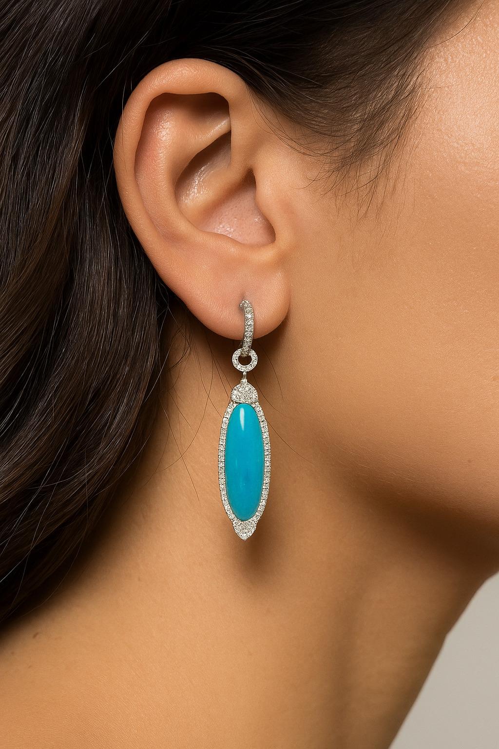 Ces élégantes boucles d'oreilles en turquoise sont la pièce d'apparat parfaite pour toutes les saisons, en particulier cet été. Leur teinte bleue vibrante offre un éclat de couleur audacieux qui attire naturellement le regard, rehausse n'importe