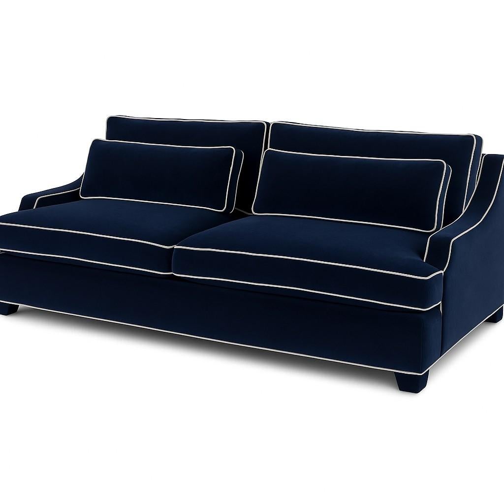This comfortable and modern sofa is a study in streamlined design and understated elegance. It features a plush, upholstered seat and back, the contours of which are gracefully outlined by a simple piping detail. This piping adds a subtle but