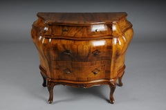 Elegant Venetian walnut bombé chest of drawers from the mid-20th century.