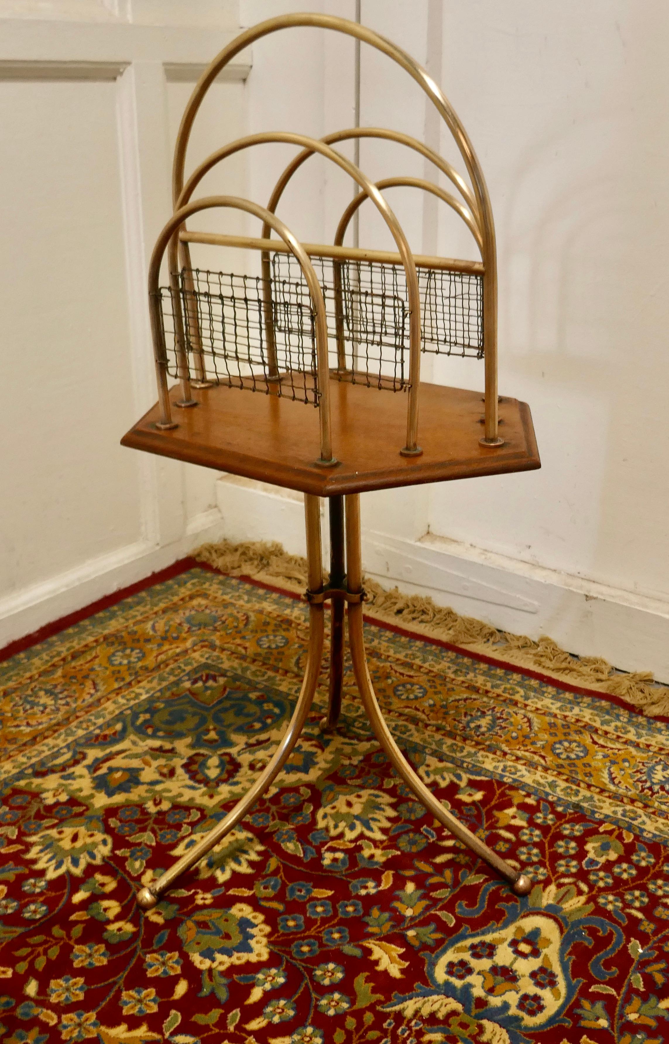 Elegant Victorian Golden Oak and Brass Revolving Magazine Rack


This is a very attractive hooped brass magazine rack it is set onto a Golden Oak base which sits on a three legged brass stand 
The Rack has 5 large brass hoops and mesh infill and it