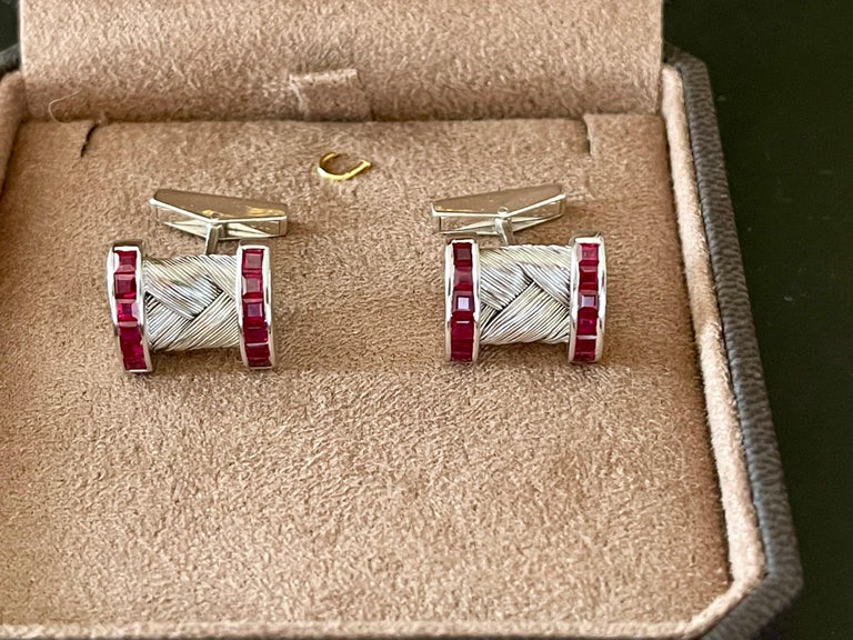 A pair of very elegant and yet timeless 18 K white Gold cufflinks. Set with 24 square cut Rubies with a total weight of approximately 2.50 ct. 
Masterfully handcrafted piece! Authenticity and money back is guaranteed. Easy handling. 
For any