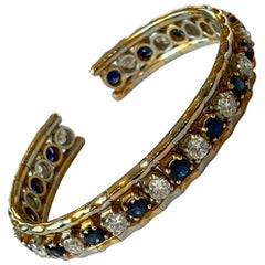 Bracelet jonc élégant vintage en or jaune et blanc 18 carats avec saphirs et diamants