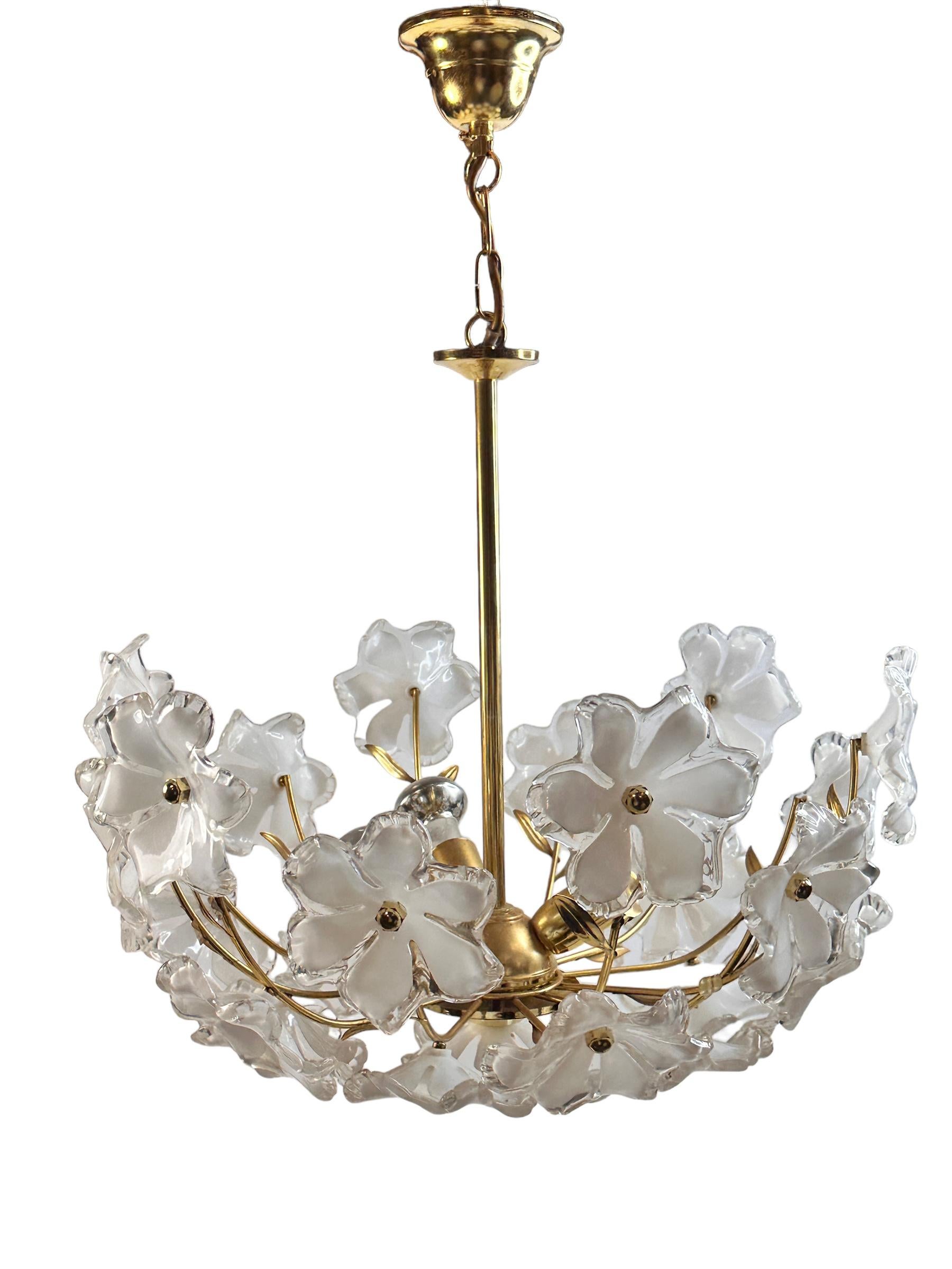 A beautiful ceiling light, made in Austria in the 1970s. Some beautiful lucite flowers. The Fixture requires three European E14 / 110 Volt Candelabra bulbs, each bulb up to 40 watts. A nice addition to every room. Found at an Estate sale in