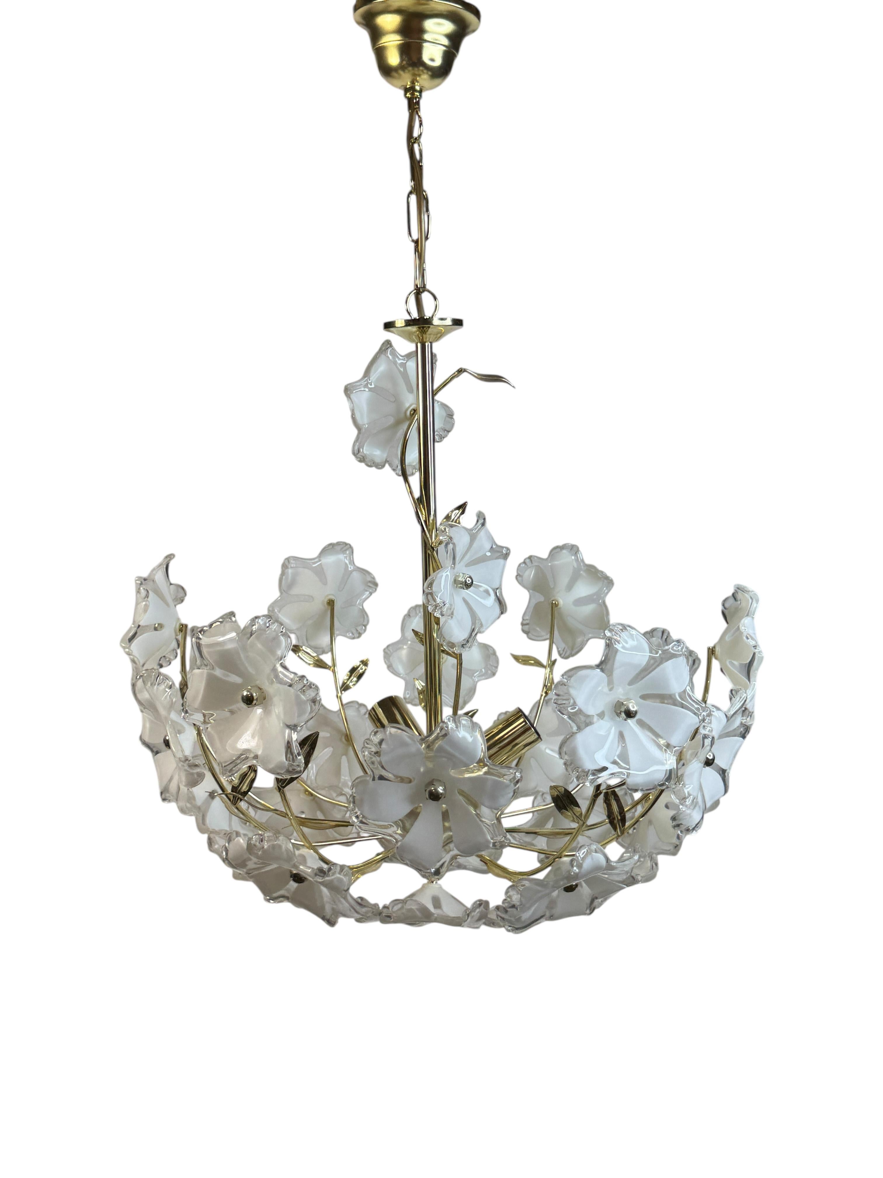 A beautiful ceiling light, made in Austria in the 1970s. Some beautiful lucite flowers. The Fixture requires three European E14 / 110 Volt Candelabra bulbs, each bulb up to 40 watts. A nice addition to every room. Found at an Estate sale in