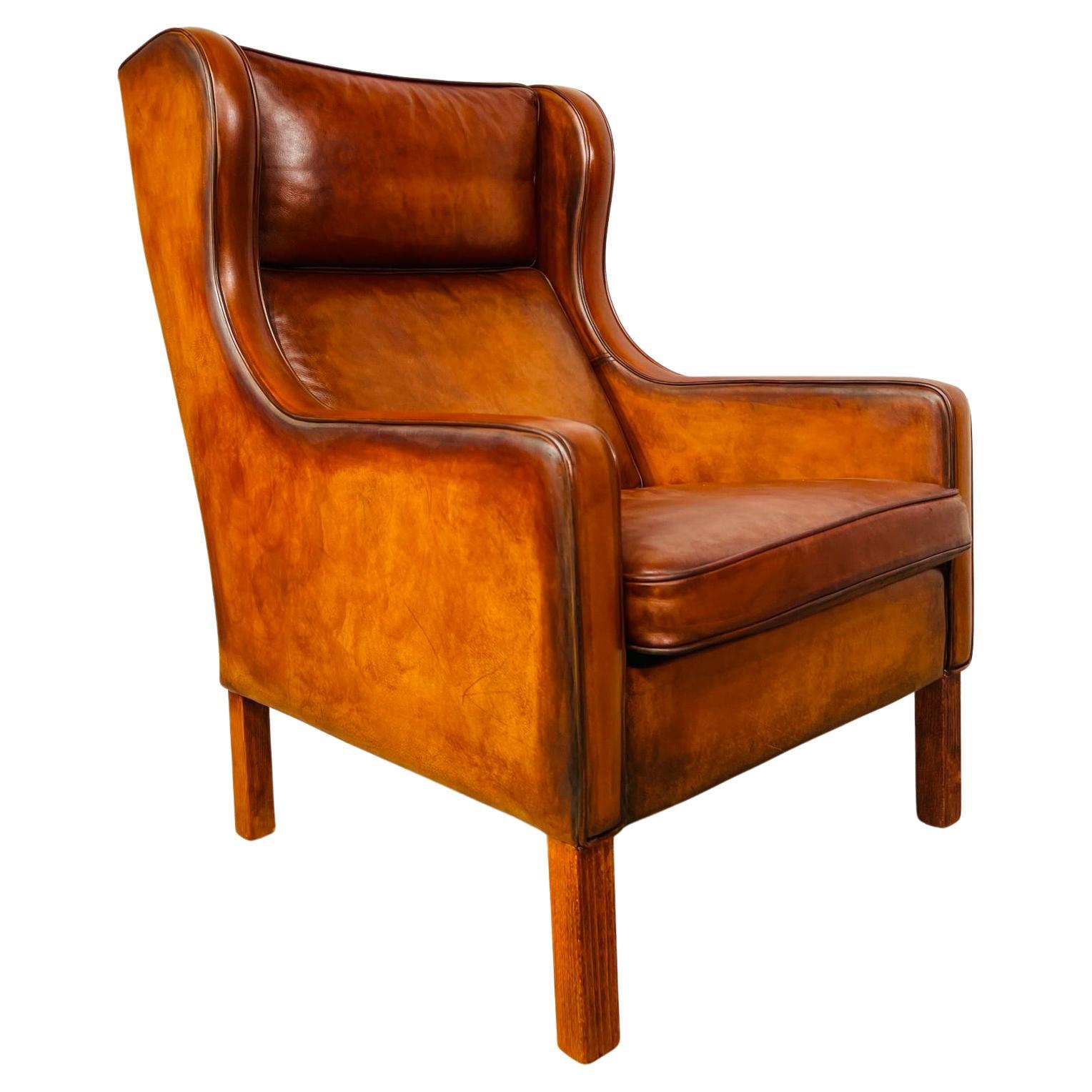 Fauteuil danois élégant en cuir des années 70, fauteuil Wingback n° 654