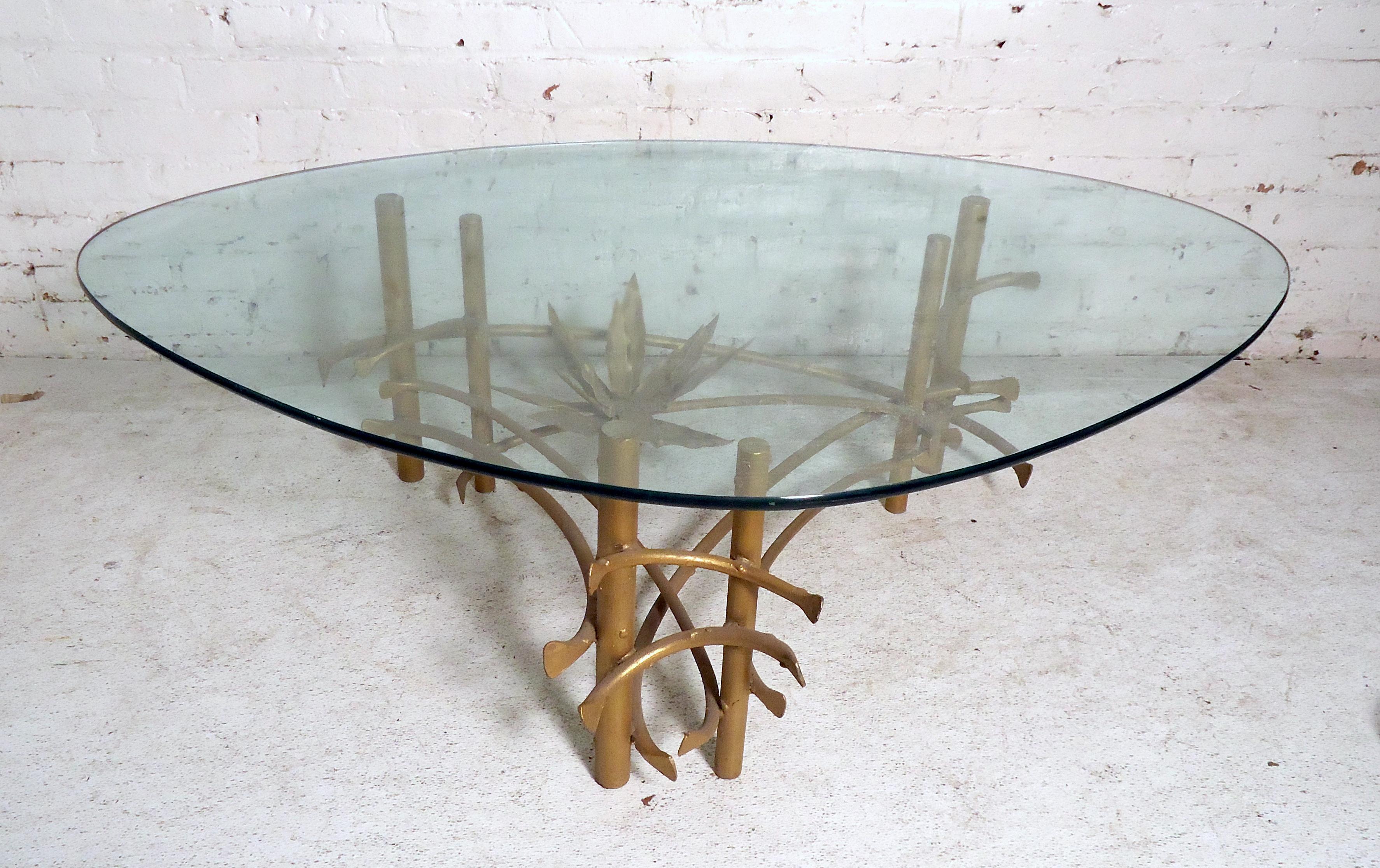 Unique Mid-Century Modern coffee table features a brass coated base, triangle glass with rounded edges.

Please confirm item location NY or NJ with dealer.