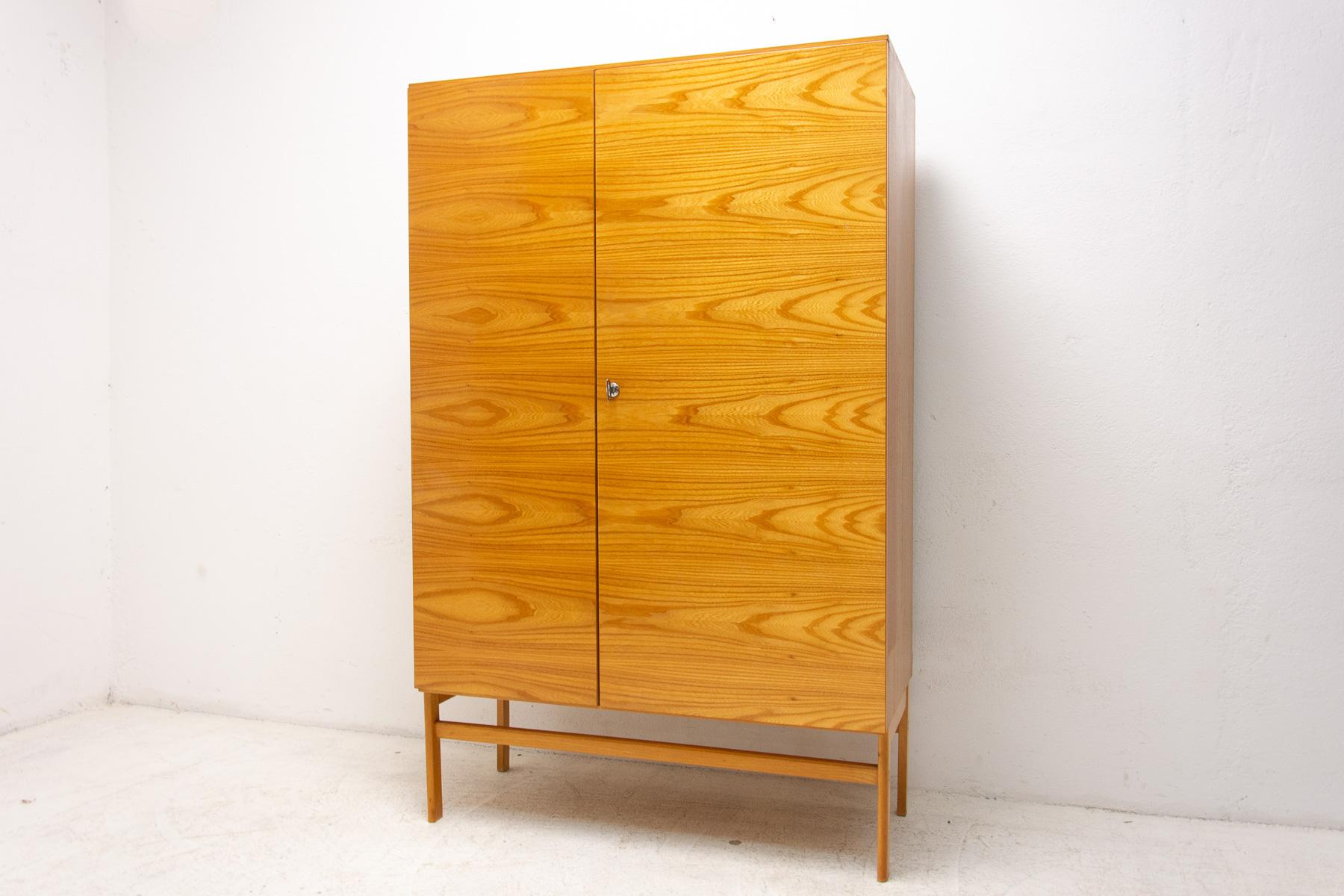 This Elegant vintage wardrobe was made by Jitona company in the former Czechoslovakia in the 1970´s. There is one clothes rail inside and a storage space next to it. In very good Vintage condition, showing slight signs of age and using. It´s made of