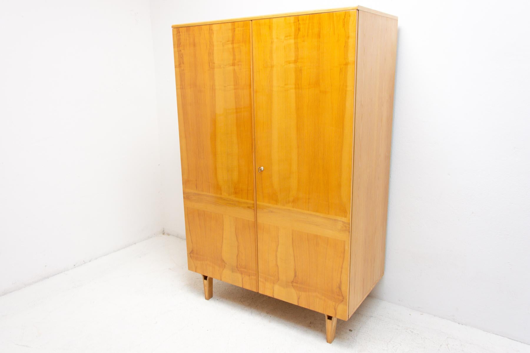 This elegant vintage wardrobe was made by Nový Domov company in the former Czechoslovakia in the 1970´s. Inside is one rod for the clothes and storage space. In good Vintage condition, showing slight signs ao age and using. It´s made of ash and