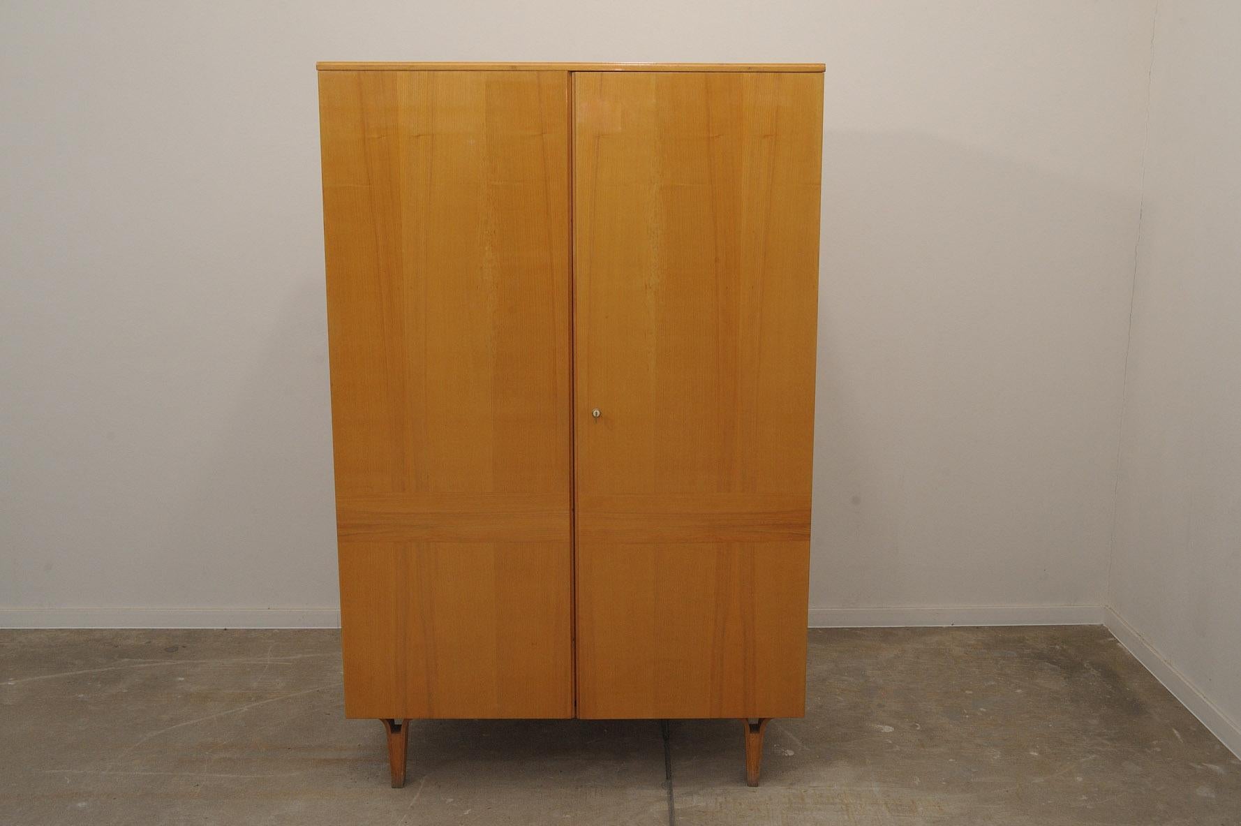 This Elegant vintage wardrobe was made by Nový Domov company in the former Czechoslovakia in the 1970´s. Inside there is one clothes rail and storage space. The inner shelf is missing from the photos, but it´s available. In good Vintage condition,