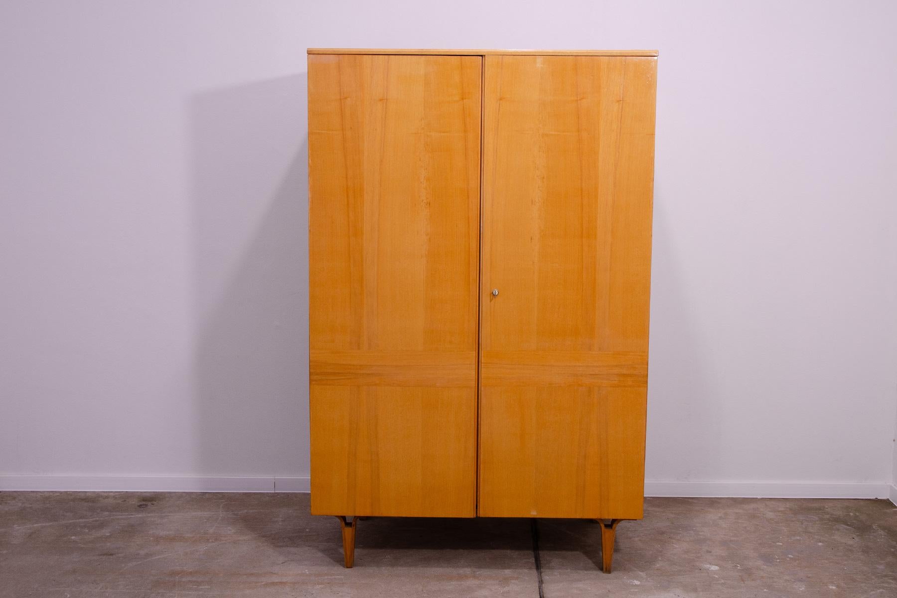 This Elegant vintage wardrobe was made by Nový Domov company in the former Czechoslovakia in the 1970´s. Four massive shelves for clothes inside. In good Vintage condition, showing signs ao age and using. It´s made of ash wood and plywood.

Height: