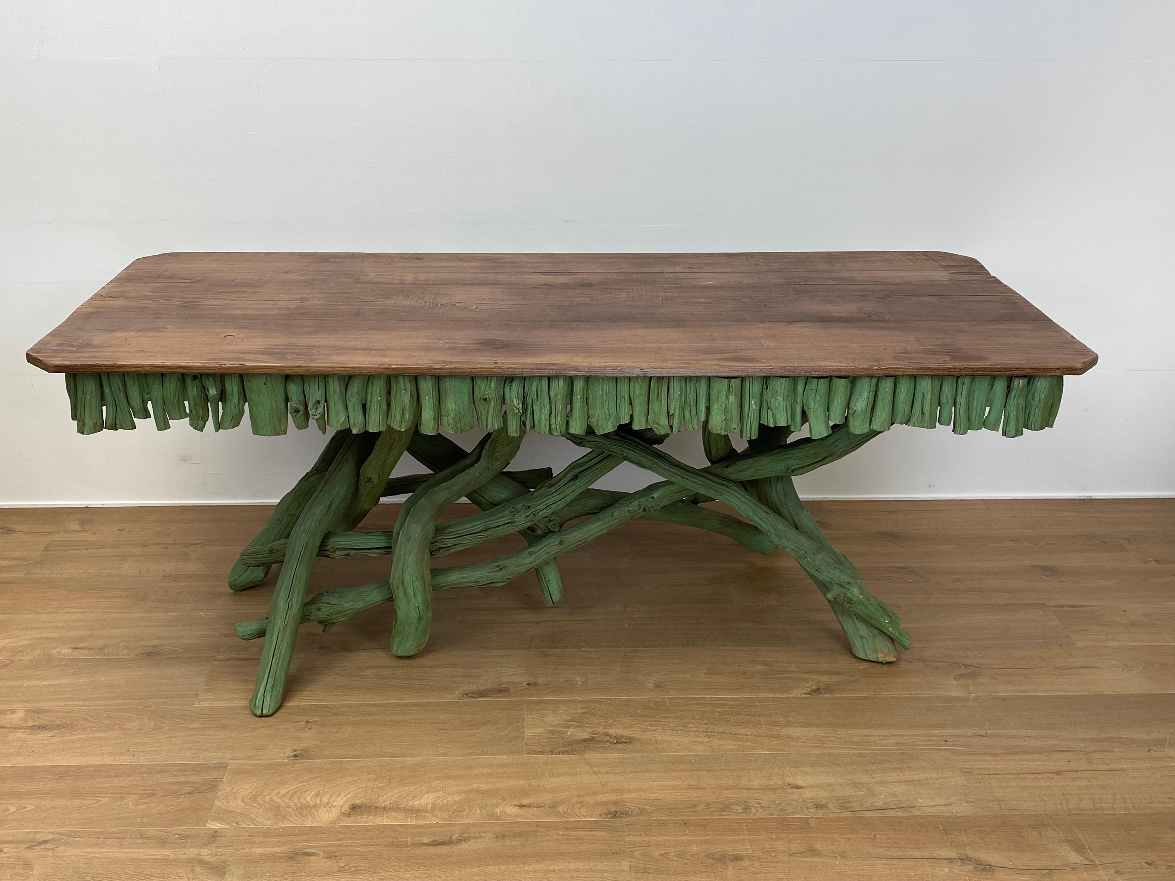 Exceptional rectangular Vintage Wooden table painted in a vivid Green Color,
France from around 1970,
the base is made out of a structure of branches of a Tree,
the top of the table is made of wooden plank,
very decorative table with a lot of