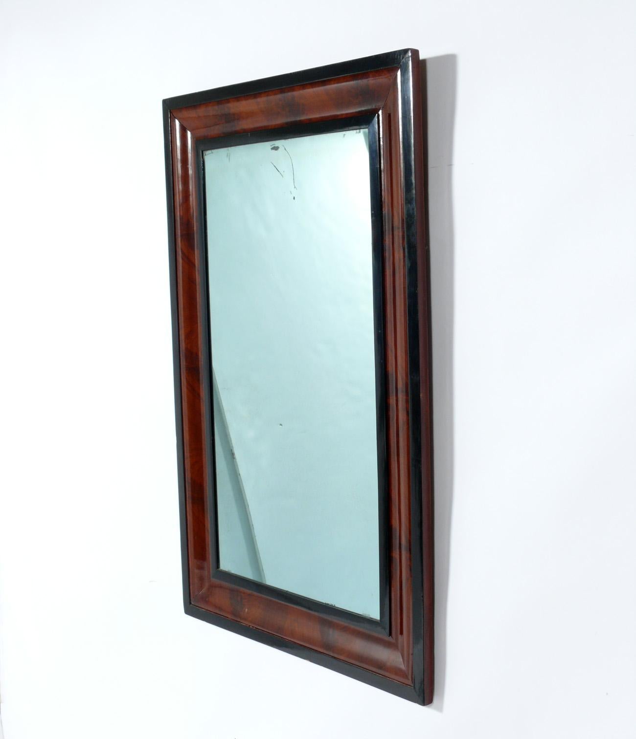 Elegant walnut mirror, American, circa 1930s. It measures 45.5