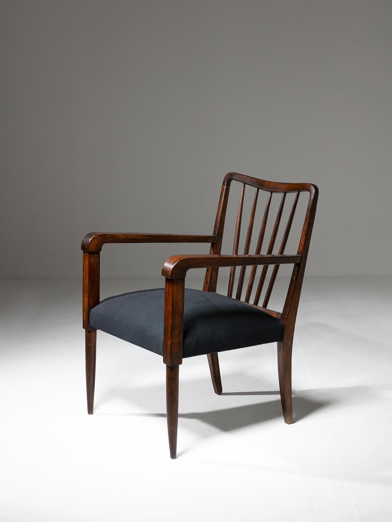 Italian 50s armchair in the style of Paolo Buffa featuring sturdy and detailed wood frame. 