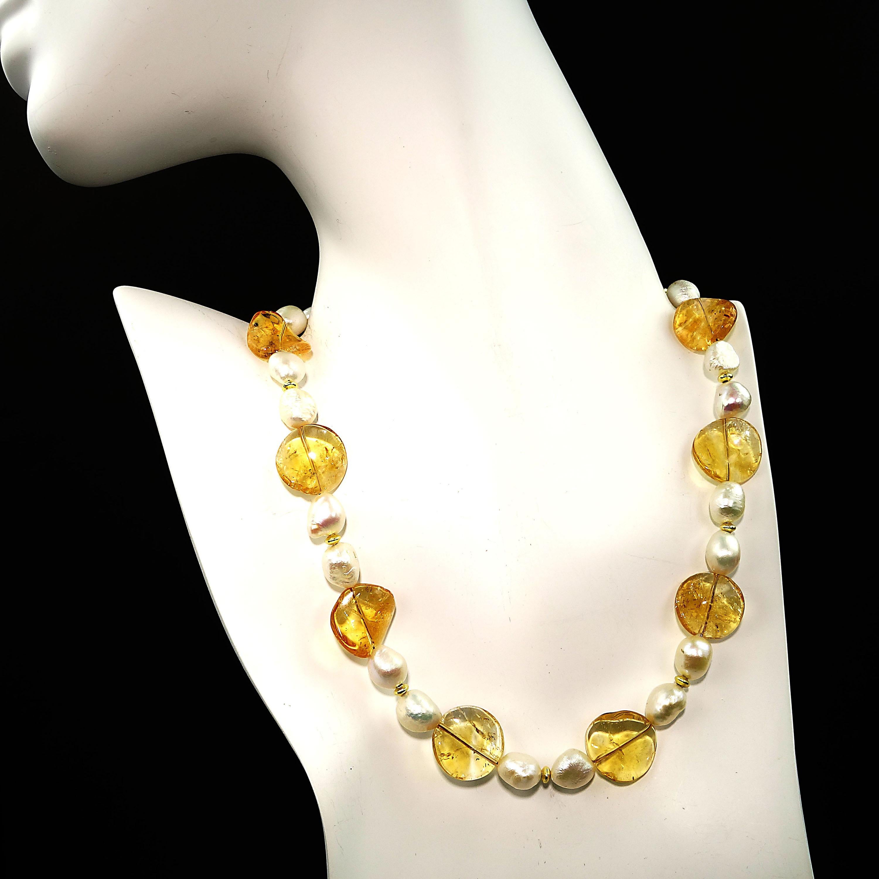 Delicate, handmade choker of wavy transparent discs of Citrine and iridescent white Baroque Pearls.  This lovely choker is a must have for all you Citrine lovers.  The pearls are spaced with goldy accents, and the 16 inch choker is secured with a