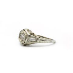 Elegant White Gold Ring with Round Brilliant and Baguette Diamonds