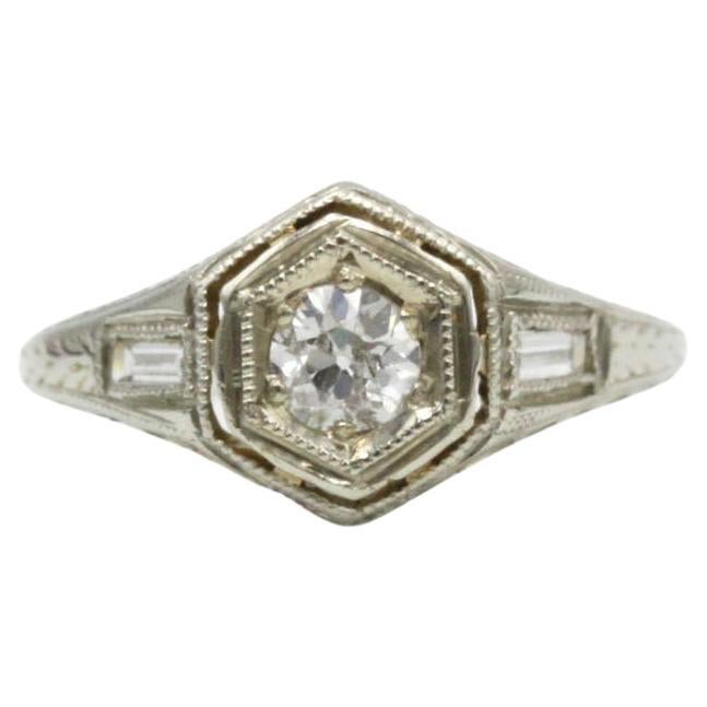 Elegant White Gold Ring with Round Brilliant and Baguette Diamonds