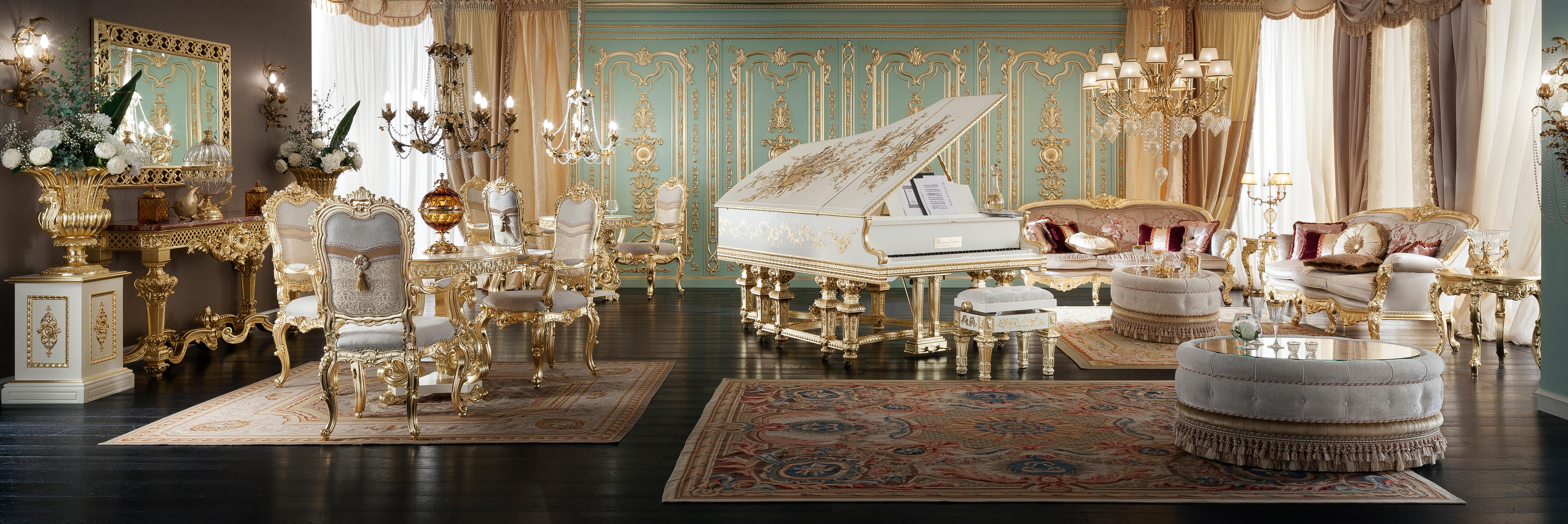 Enjoy your unique customized piano while playing it sitting on one of our most beloved poufs. Its four empire legs end with a firm and robust lion's paw and all its wooden surfaces are decorated with white finish and gold leaf applications. Designed