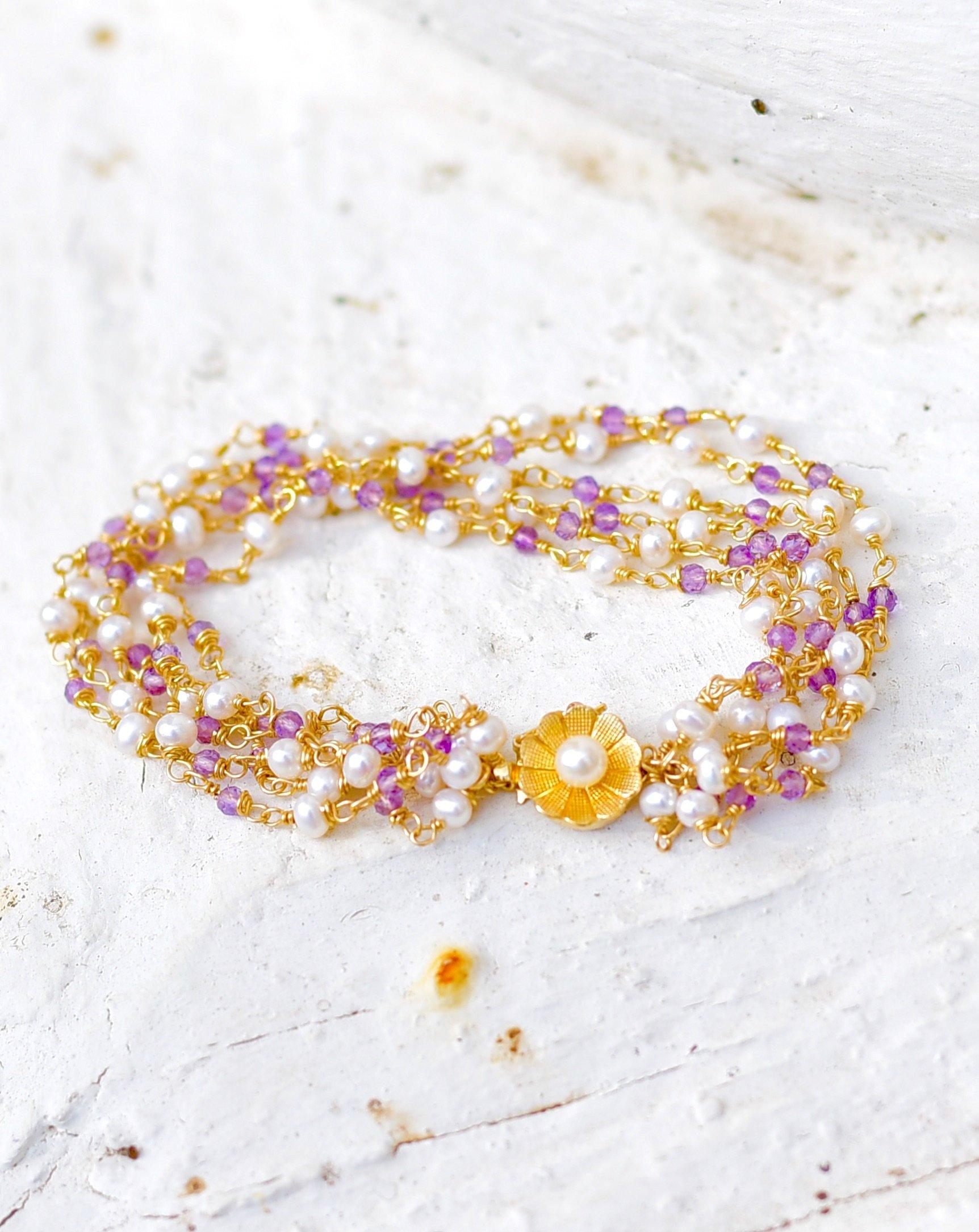 A luxe 6-strand bracelet brimming with white freshwater pearl and lavender purple amethyst beads. A sweet 14K solid yellow gold cultured white pearl flower clasp is stunning and matching for every detail. Summerly cute and feminine! 