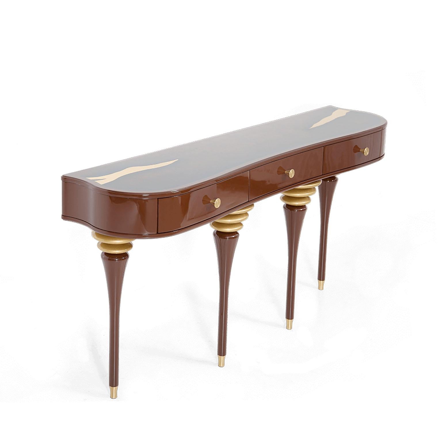 Exclusive console inspired by traditions of One Thousand and One Nights. Available in a curated selection of fashionable finishes, this elegant console table is crafted of solid wood finished in high gloss and supported by elegant legs. Triple red