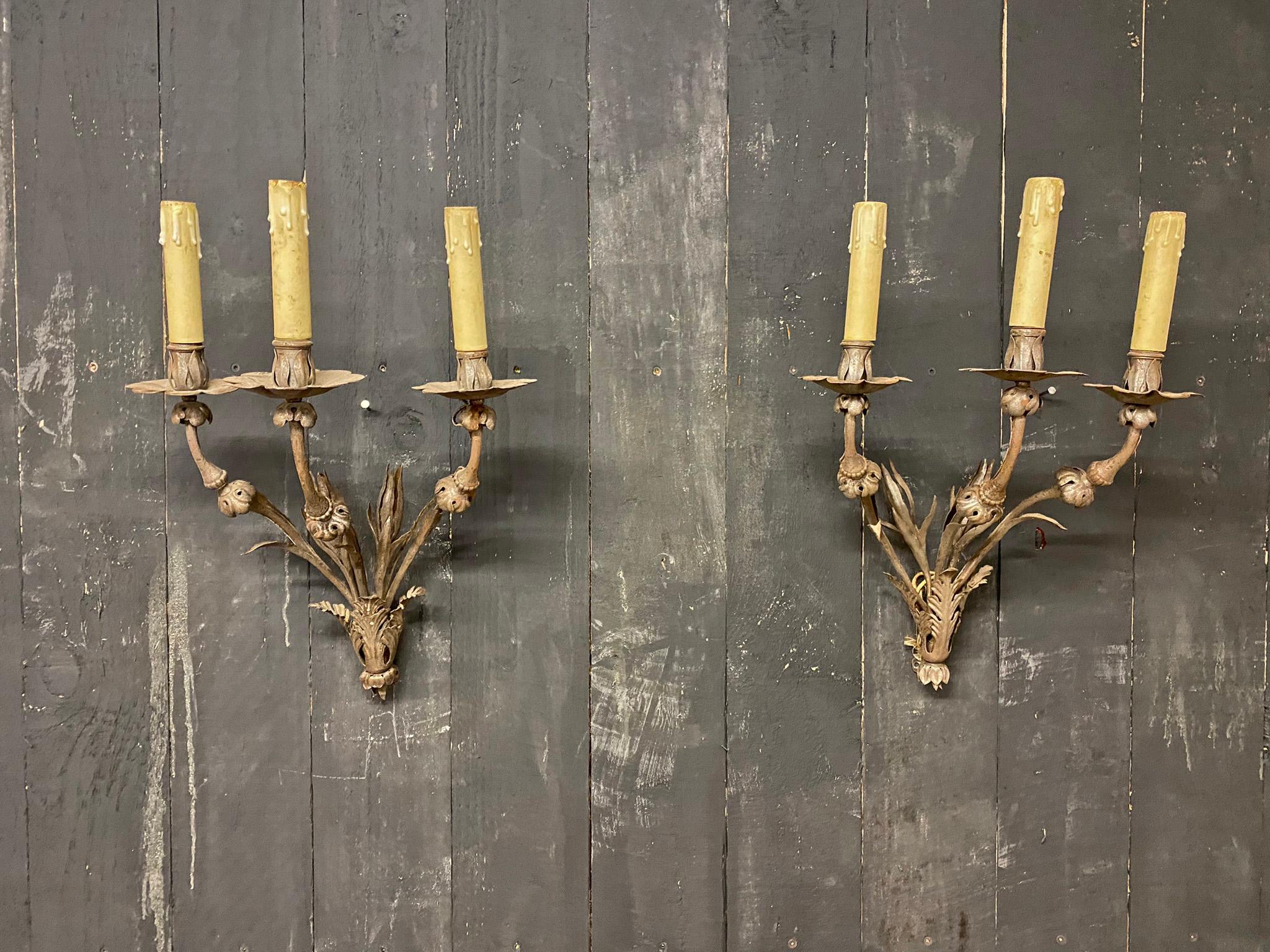 Elegant wrought iron sconces from a chateau in central France. around 1940/1950
3 Wall lights with 3 lights.
the price is for one, 3 are available

The iron has not been lacquered, not treated and tends to oxidize.
They are sold as is, possibility