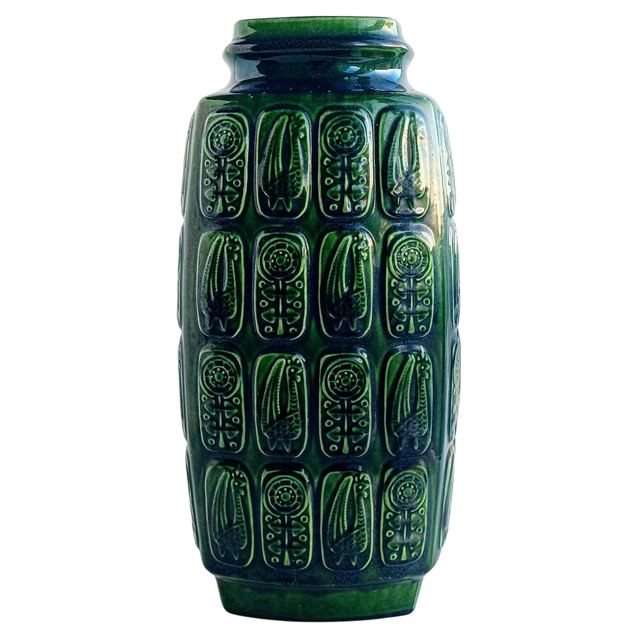 Beautiful extra large West German pottery floor vase created by house designer Bodo Mans featuring the  very rare ¨Pharaon Decor¨ in a green forest hue glaze. Hand-produced in West Germany circa the 1960s. 

Coded and marked Bay, form 942 - 45. The