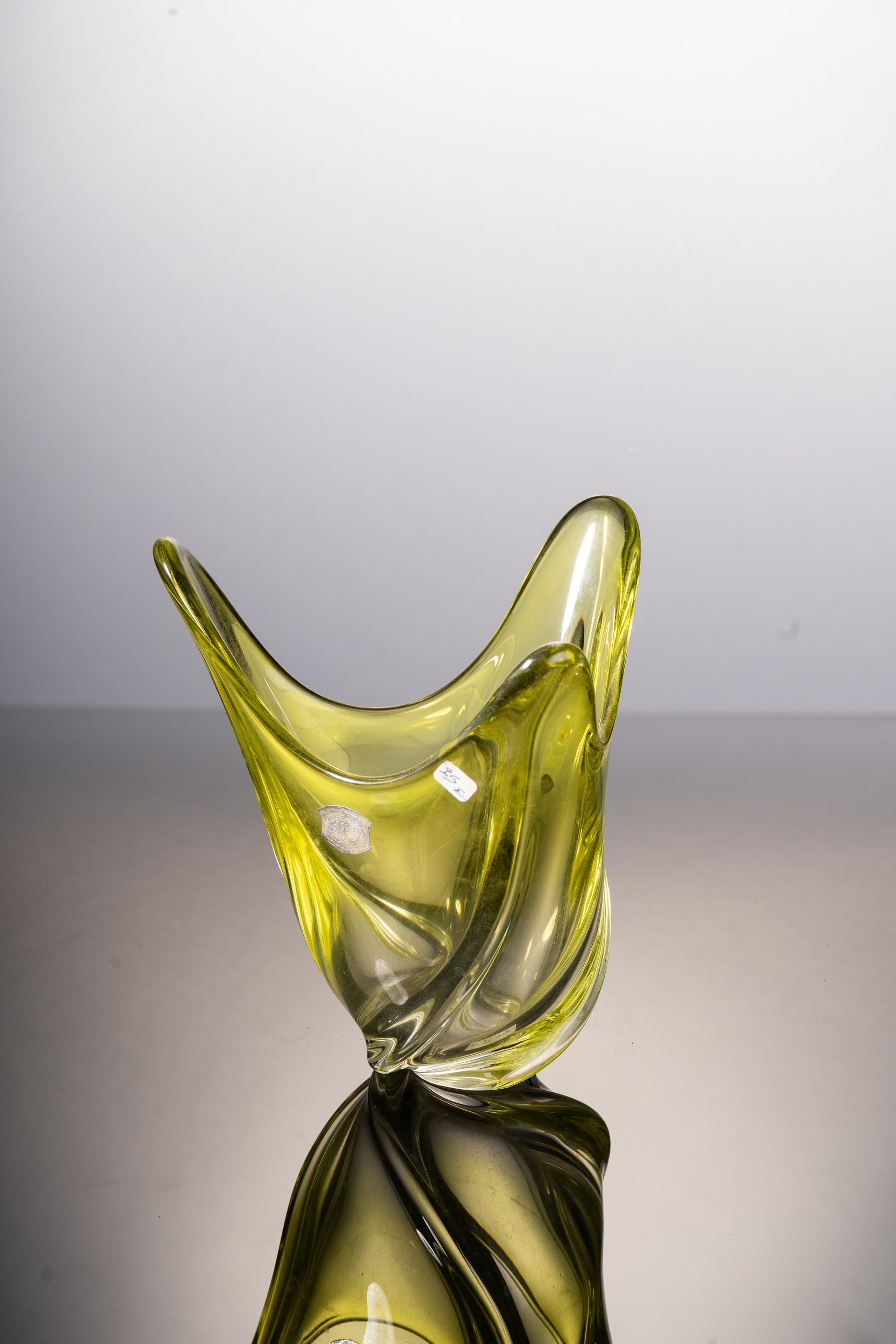 Strikingly elegant hand blown yellow and clear glass vase. The base has a twisted design and the top resembles three blooming petals. Mint condition.