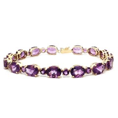 Eleganza in oro giallo: bracciale alternato con ametista ovale e rotonda