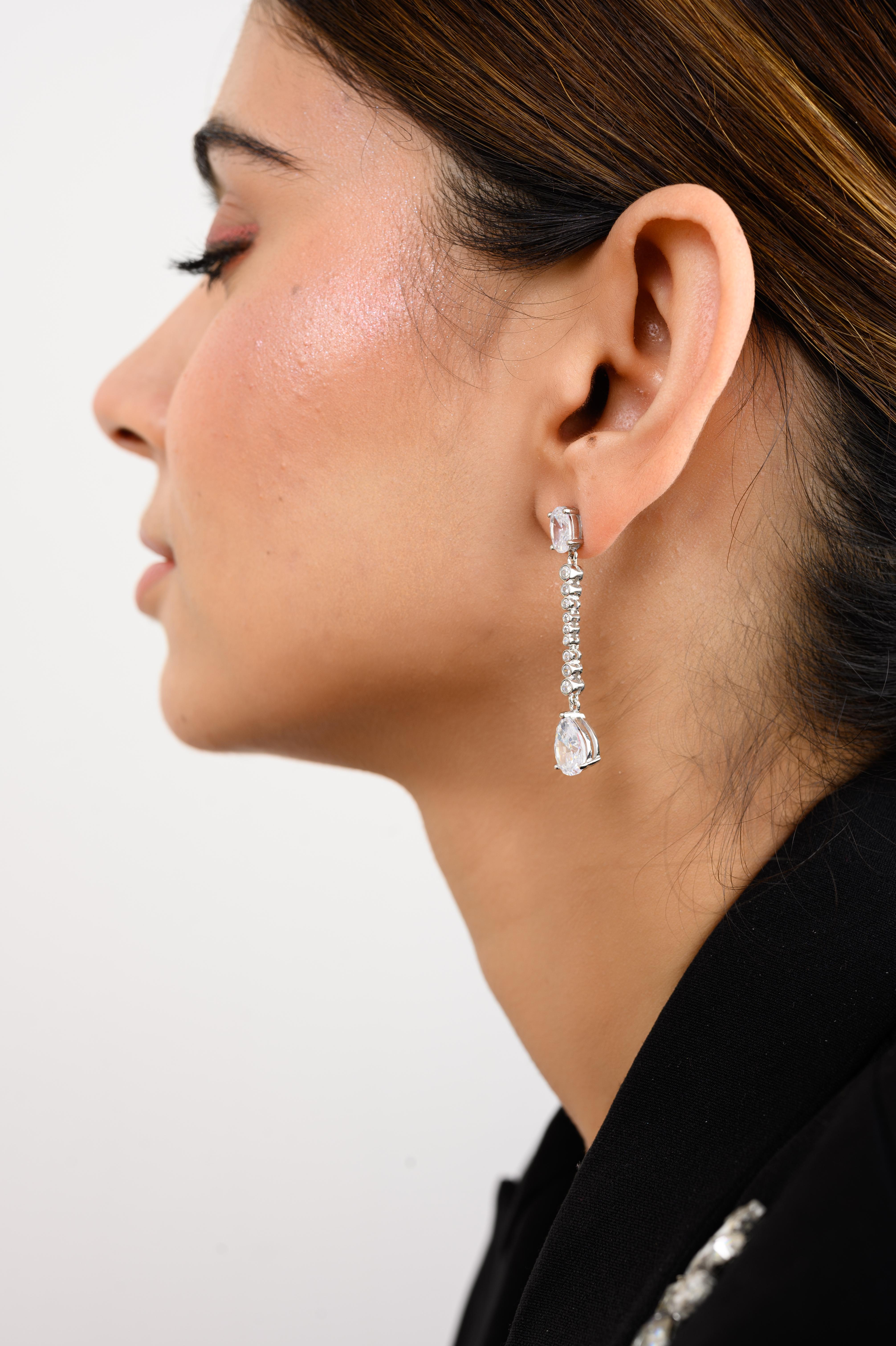 Elegant Zircon Long Drop Dangle Earrings for Women in sterling silver. You shall need long dangle drop earrings to make a statement with your look. Each piece features dazzling cubic zirconia stones, renowned for their brilliance and clarity, set in