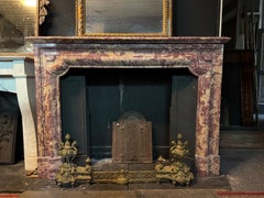 Elegant antique mantle fireplace in polychrome marble peach blossom, italy