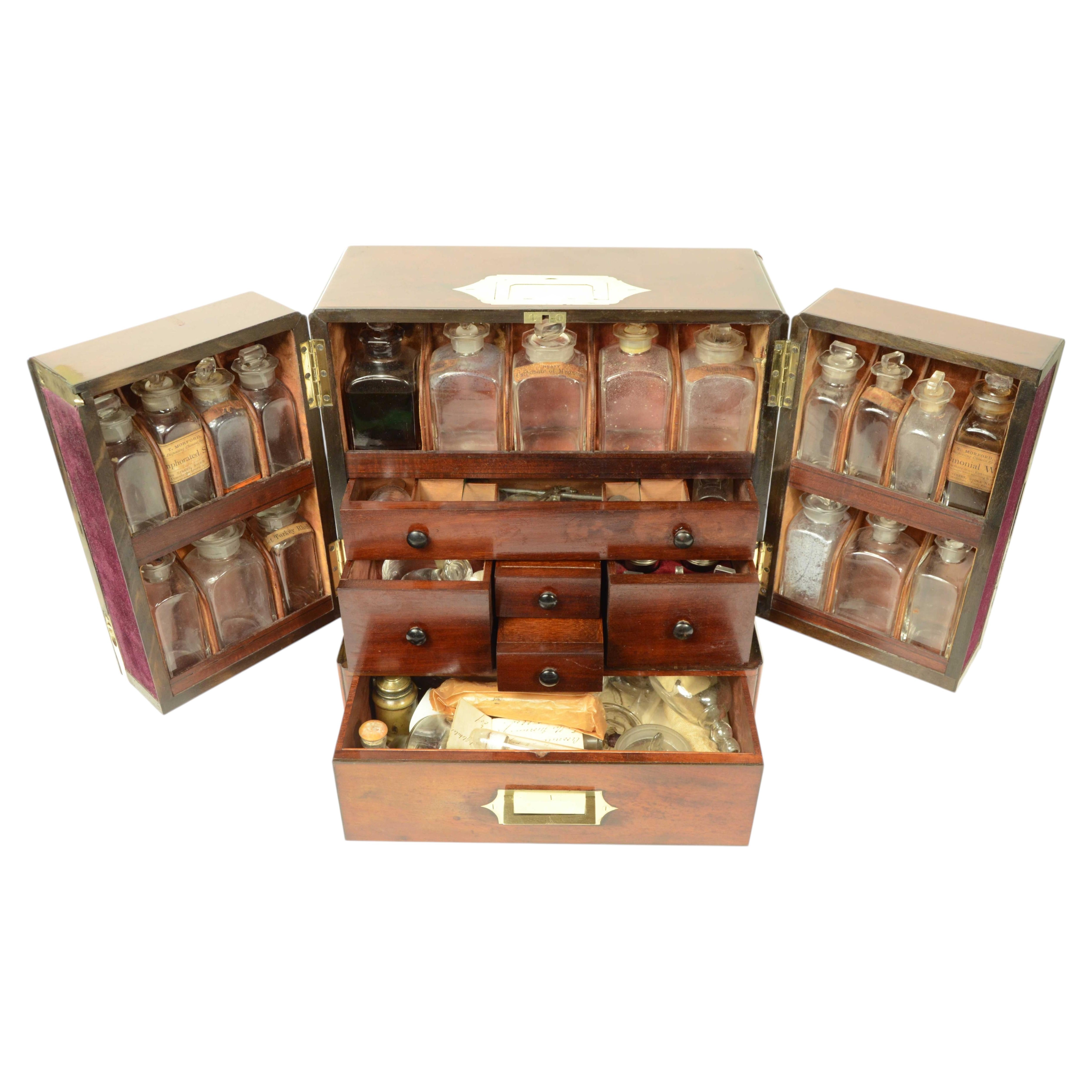 Elegant and rare early 19th century English mahogany feather board pharmacy