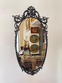 Elegant oval mirror with refined brass and Italian glass, 1960s