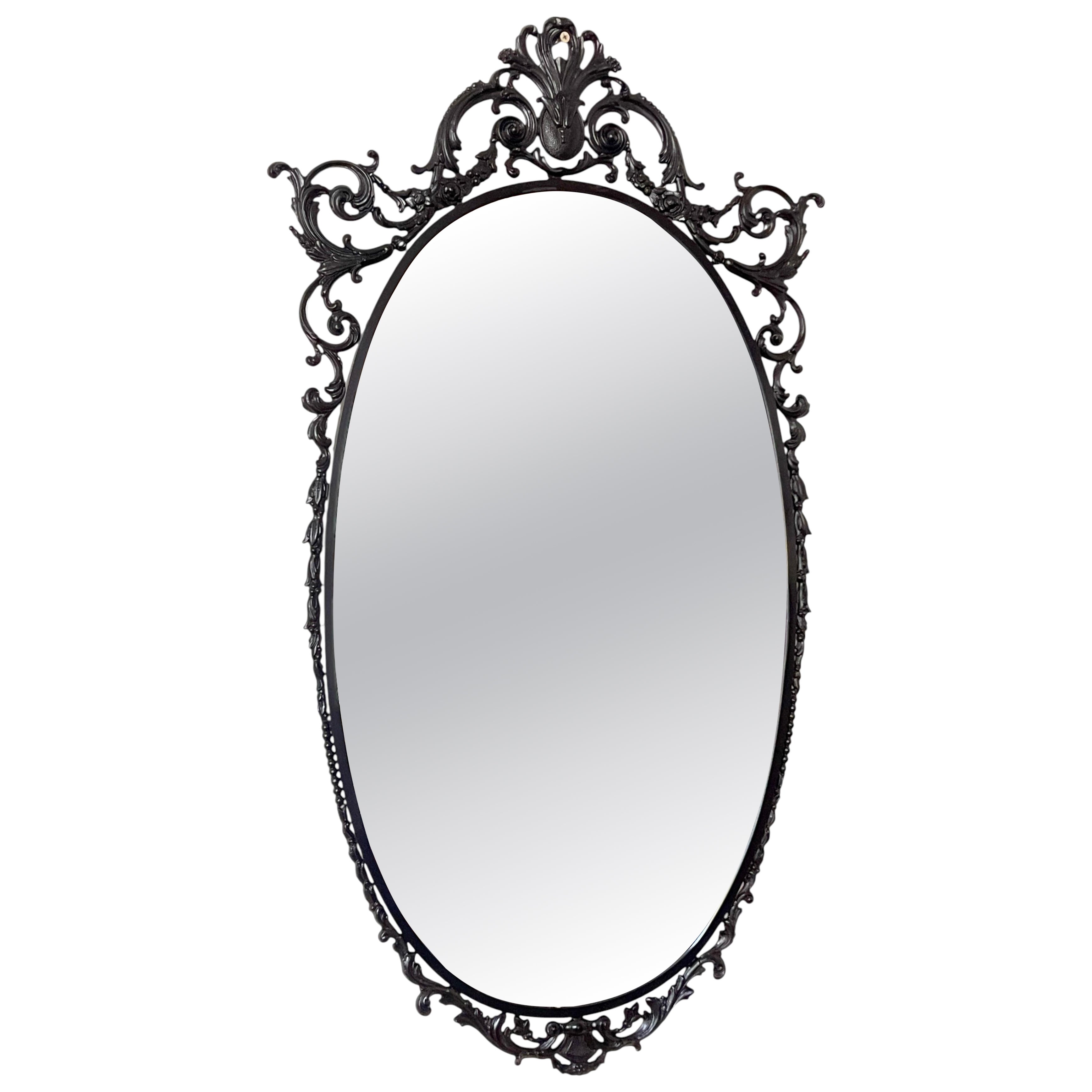 Elegant oval mirror with refined brass and Italian glass, 1960s