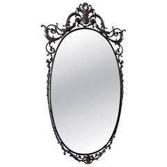 Elegant oval mirror with refined brass and Italian glass, 1960s