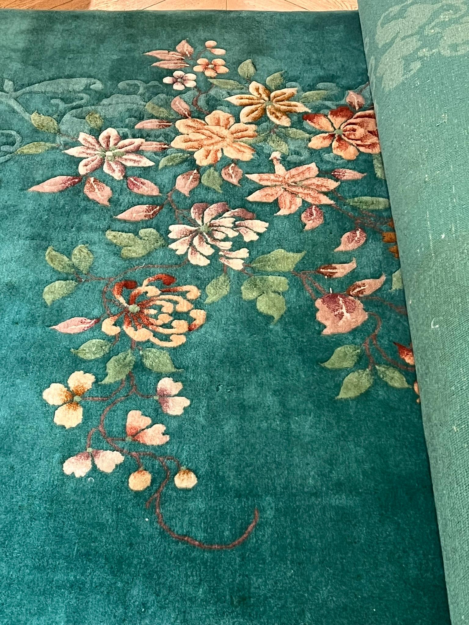 Chinese elegant emerald green carpet with cascades of flowers and ton sur ton decoration For Sale