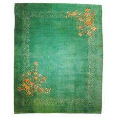 Antique elegant emerald green carpet with cascades of flowers and ton sur ton decoration