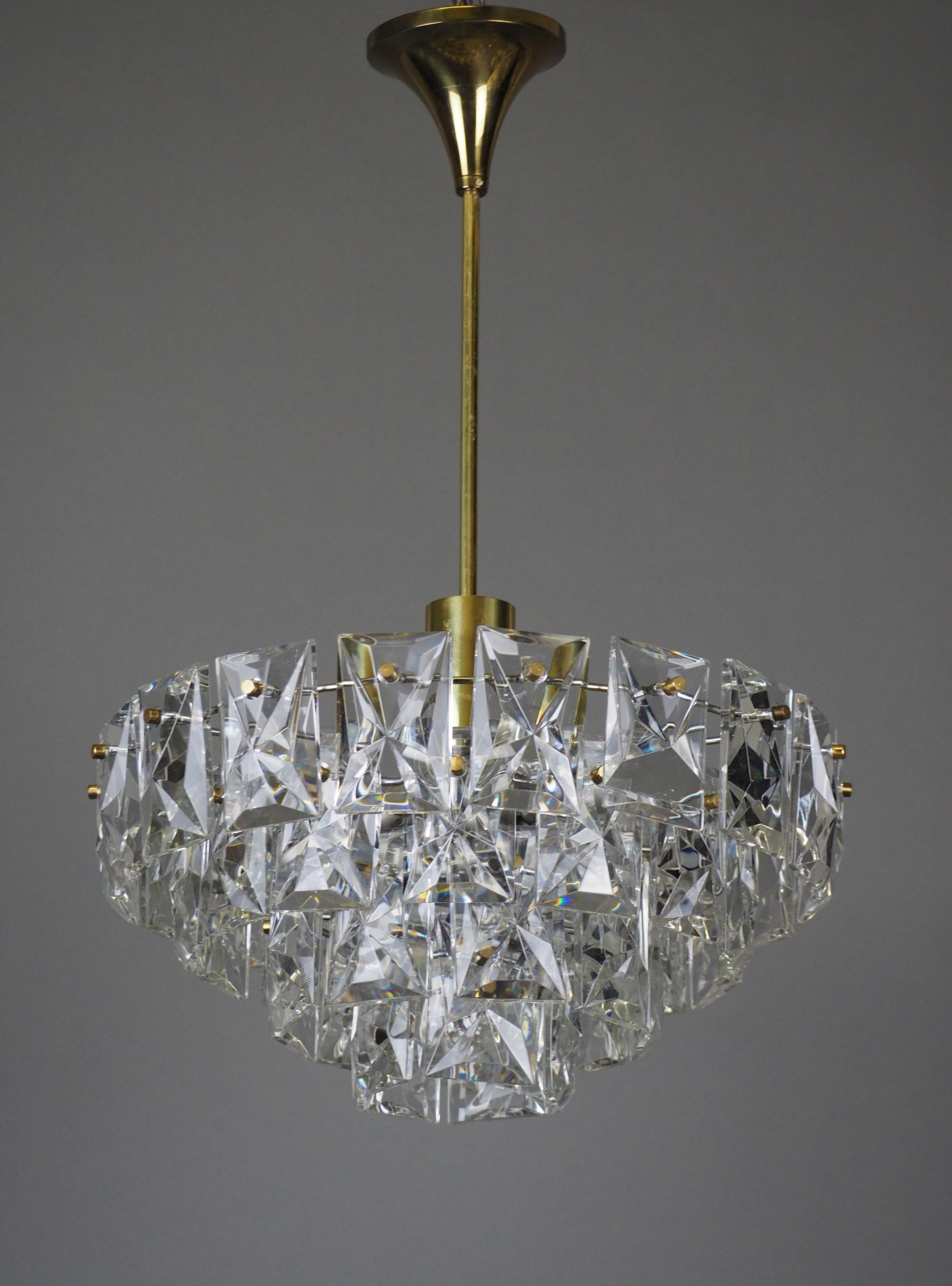 A beautiful Mid-Century Modern ten-light chandelier by Kinkeldey, Germany, circa 1960s.
High quality four tier gilt brass frame and metal frame with decorated with heavy crystal elements.
Socket: 9x e14 and 1 x e27 for standard screw bulbs.