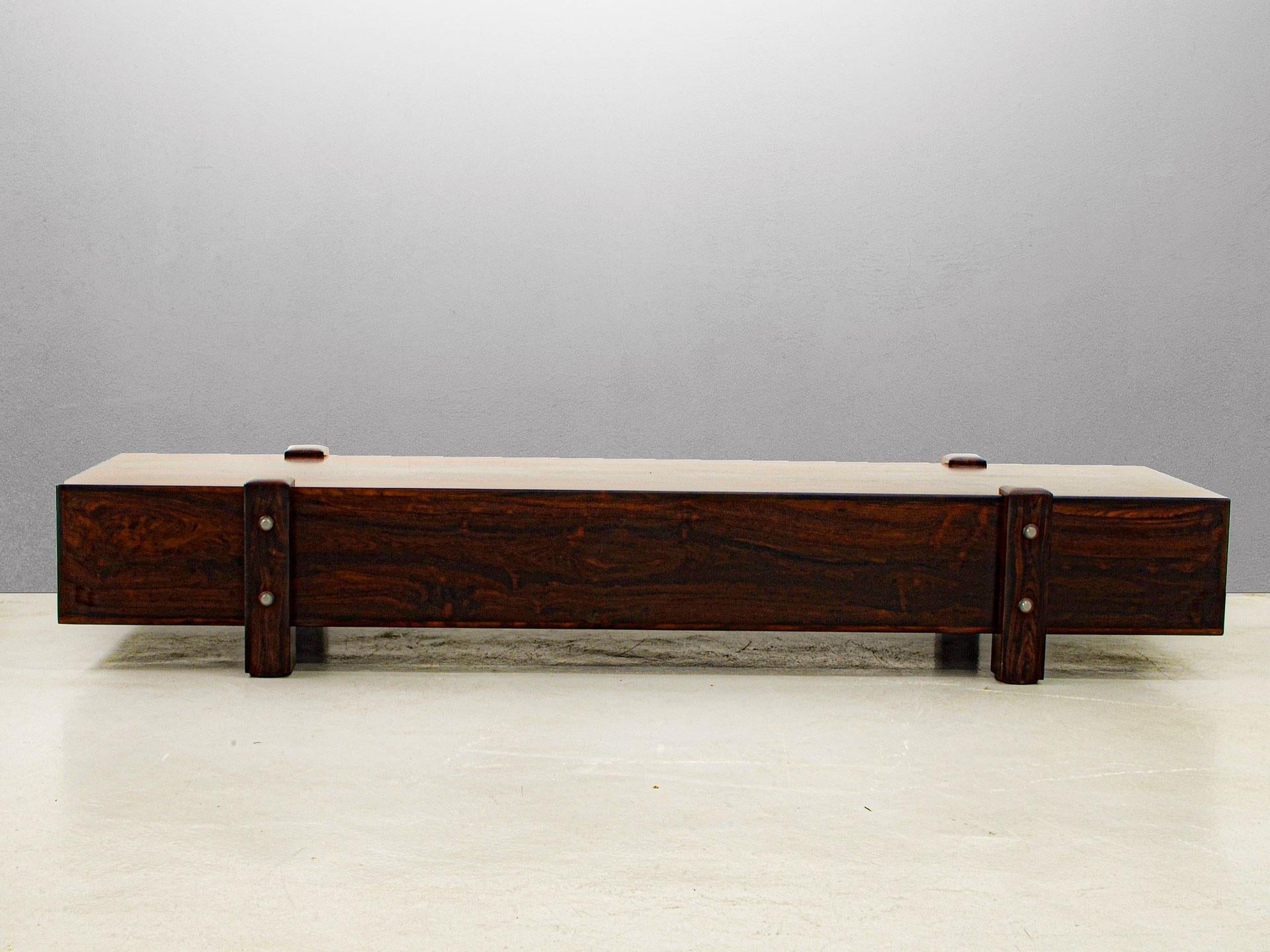 Sergio Rodrigues is known as the master of Brazilian hardwood, a material that he has perfected usage throughout his entire career. The Eleh bench is no exception, a showcase of Rodrigues's prolific ability to apply this type of tropical wood in